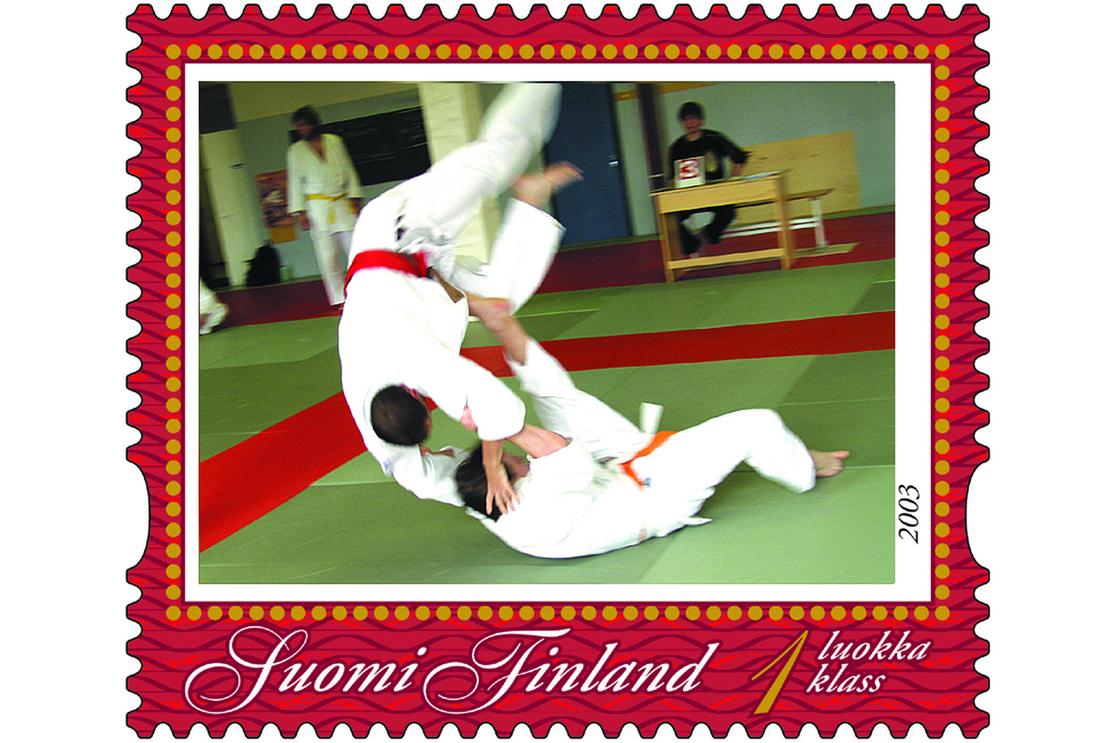 Postimerkin kuvassa judotilanne.