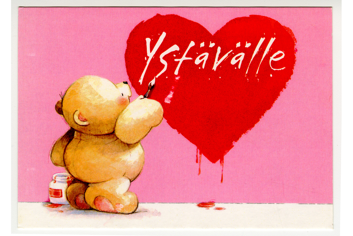 Vaakamallinen postikortti, jossa piirroskuvassa nalle maalaa sydämen sisään valkoisella tekstiä Ystävälle.