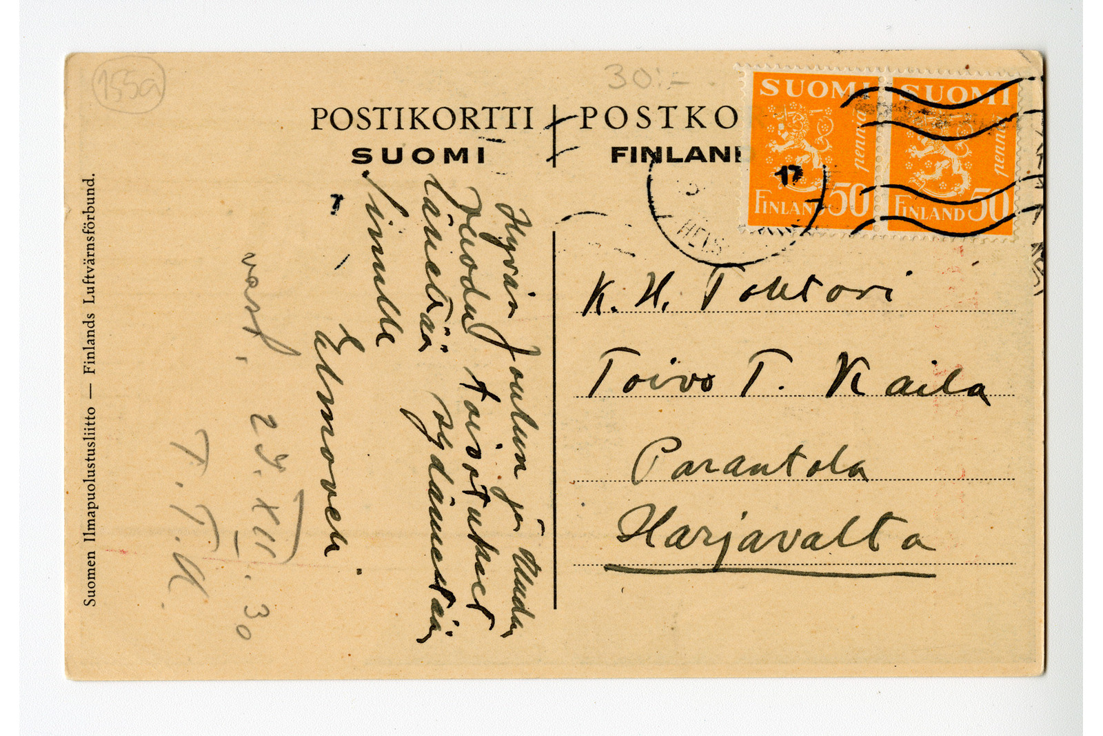 Postikortin taustapuoli, jossa on painettuna tekstinä Suomen ilmapuolustusliitto suomeksi ja ruotsiksi, kaksi malli 1930 leijona -postimerkkiä, Helsingin postileima ja vastaanottajan tietoina kirjoitettu K.H. Tohtori Toivo T. kaila Parantola Harjavalta. Joulutervehdys on kirjoitettu pystymallisesti luettavaksi.